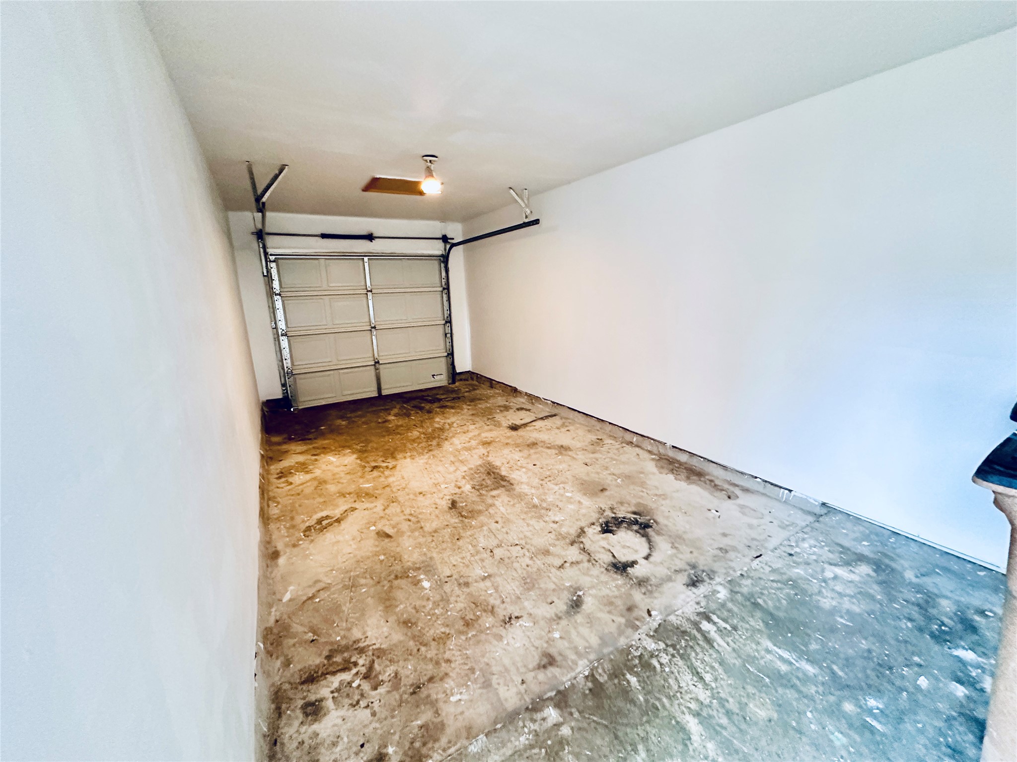 12505 Turtle Rock Road, Unit A Austin, TX 78729 - Photo 34 of 38 Functional garage space with a convenient garage door opener.
