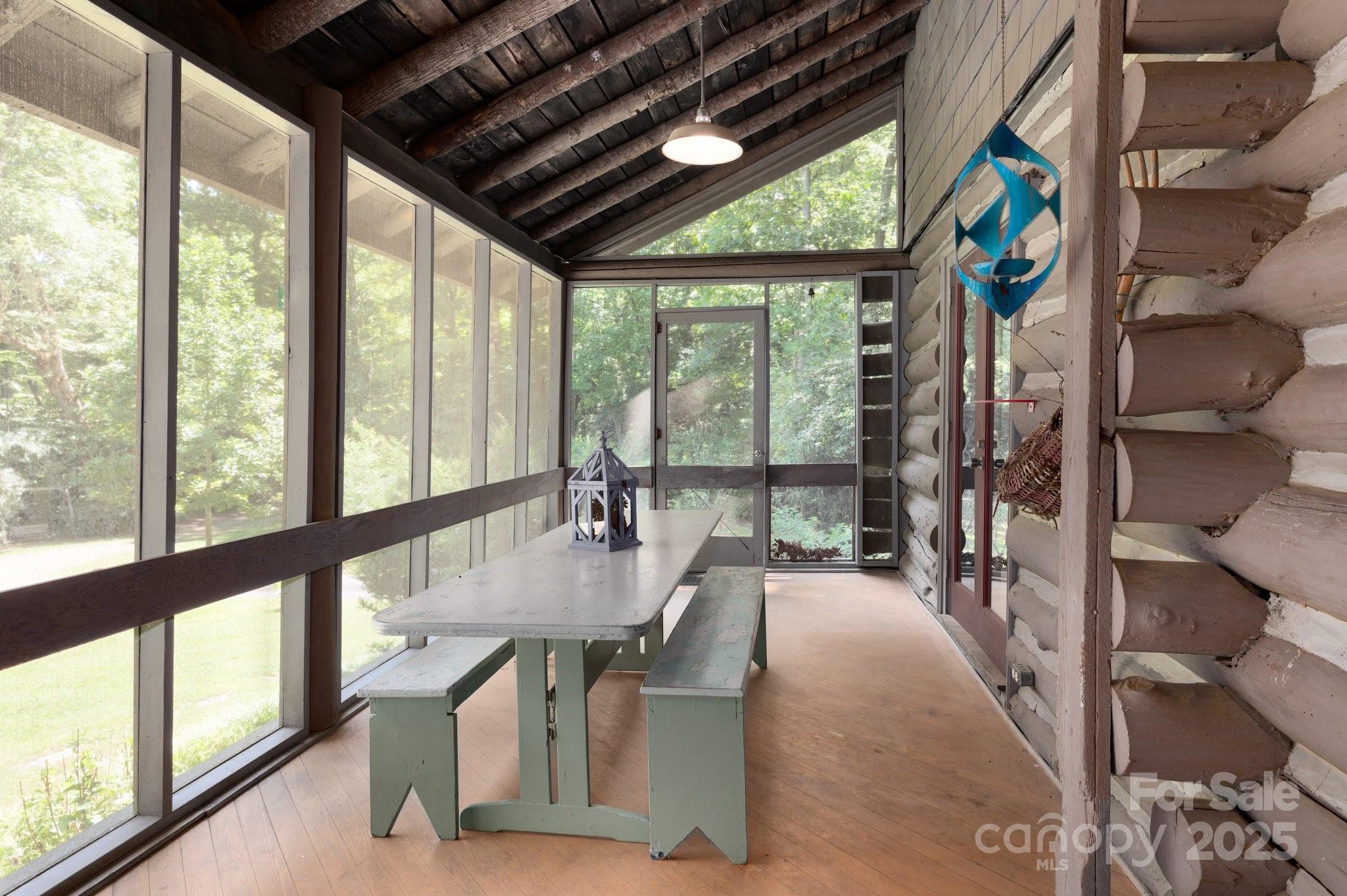 552 Averys Crk Road Arden, NC 28704 - Photo 11 of 48 a dining room with furniture and a floor to ceiling window