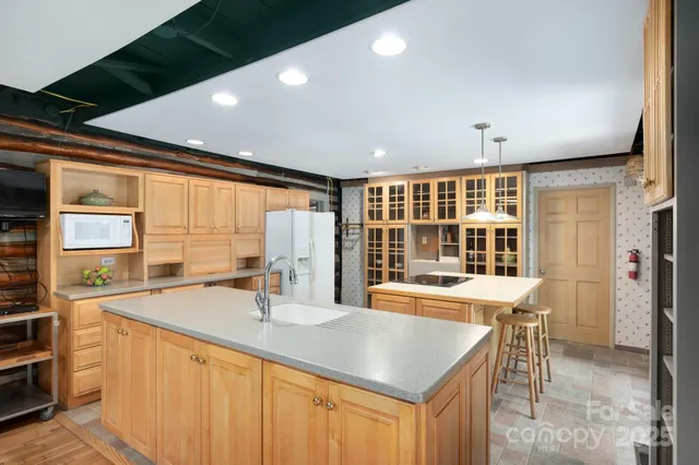 a living room with furniture a fireplace and next to a window