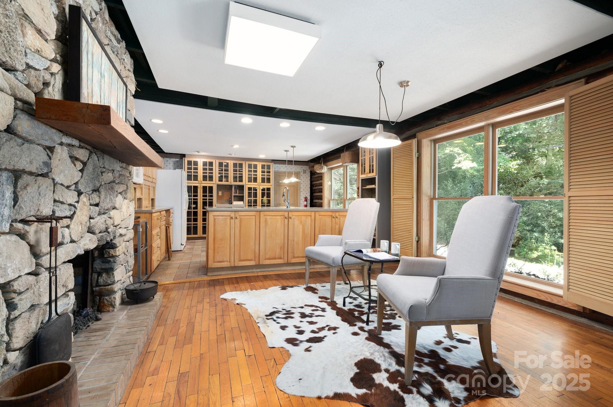 552 Averys Crk Road Arden, NC 28704 - Photo 16 of 48 a living room with furniture and a large window