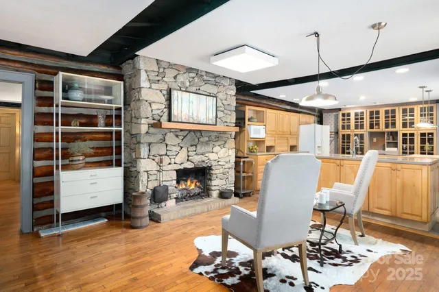 a dining room with furniture and wooden floor