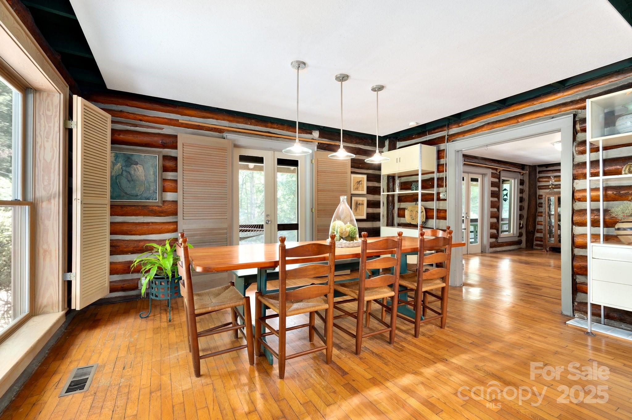 552 Averys Crk Road Arden, NC 28704 - Photo 18 of 48 a dining room with furniture window and wooden floor