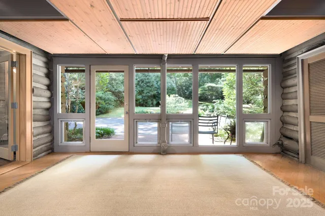 a view of a room with balcony and furniture