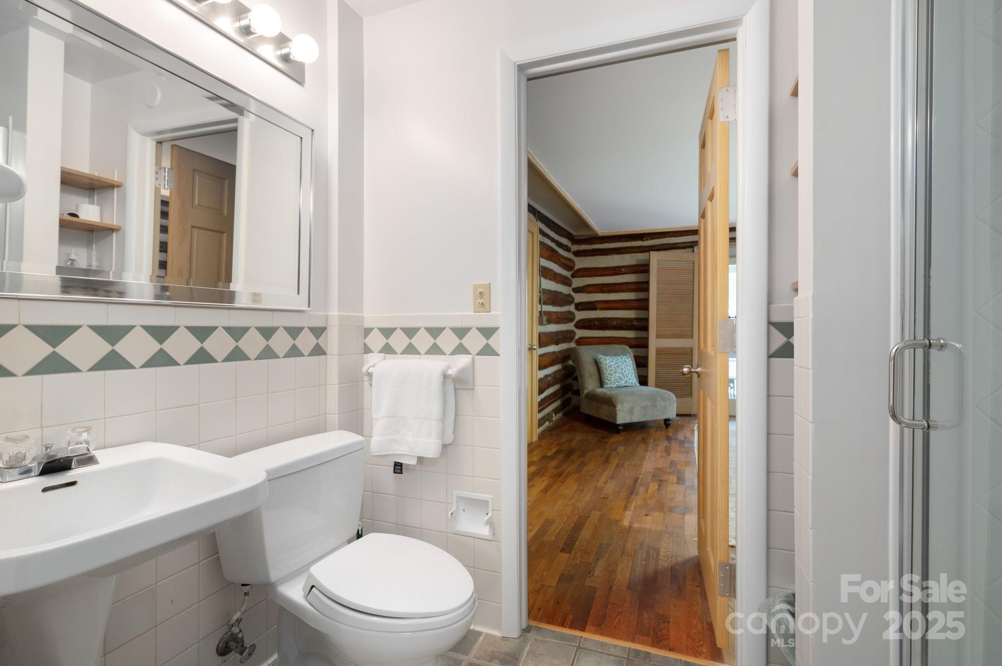 552 Averys Crk Road Arden, NC 28704 - Photo 23 of 48 a bathroom with a sink a toilet and shower