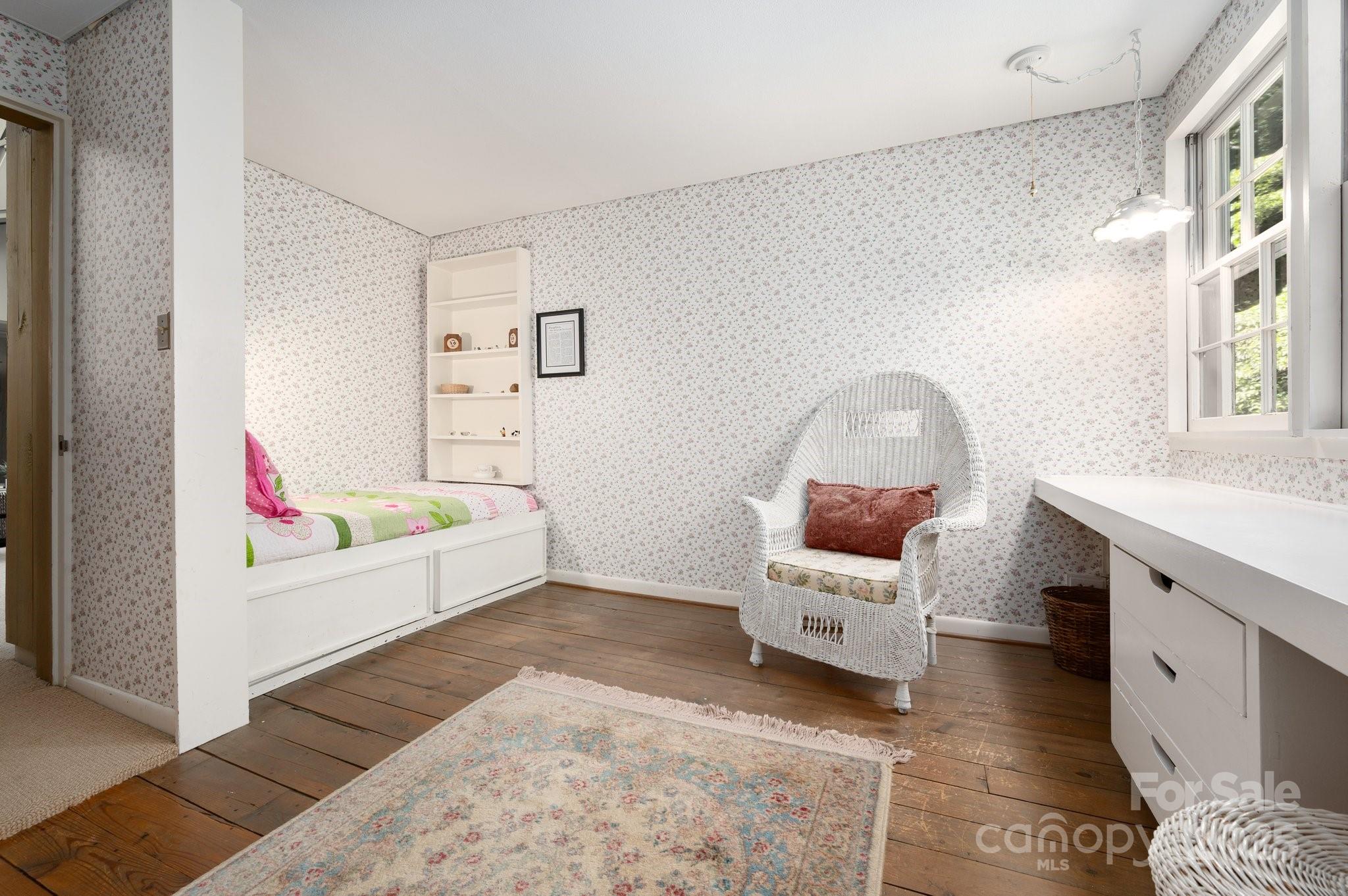 552 Averys Crk Road Arden, NC 28704 - Photo 28 of 48 a living room with furniture and a wooden floor