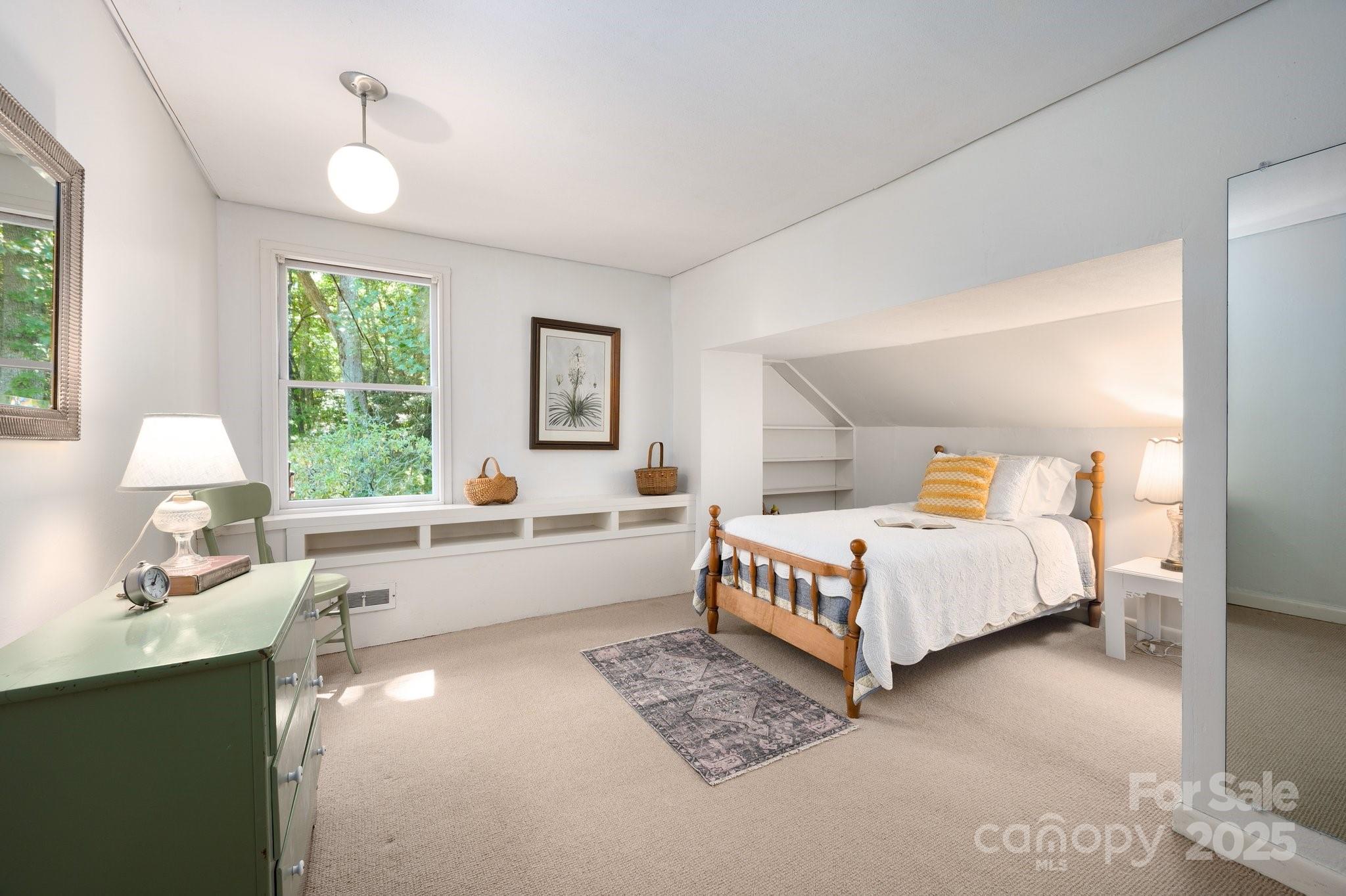 552 Averys Crk Road Arden, NC 28704 - Photo 30 of 48 a large white bed sitting in a bedroom next to a window