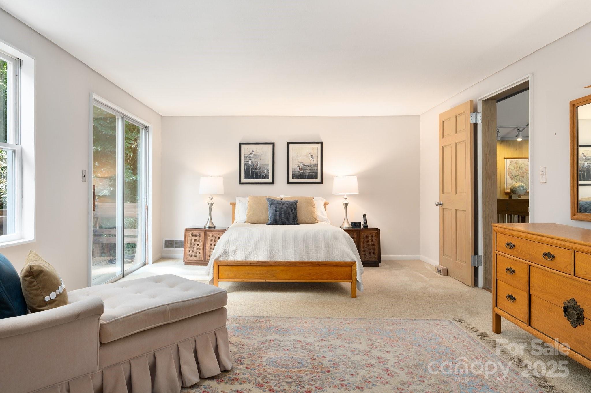 552 Averys Crk Road Arden, NC 28704 - Photo 31 of 48 a bedroom with a bed and a couch