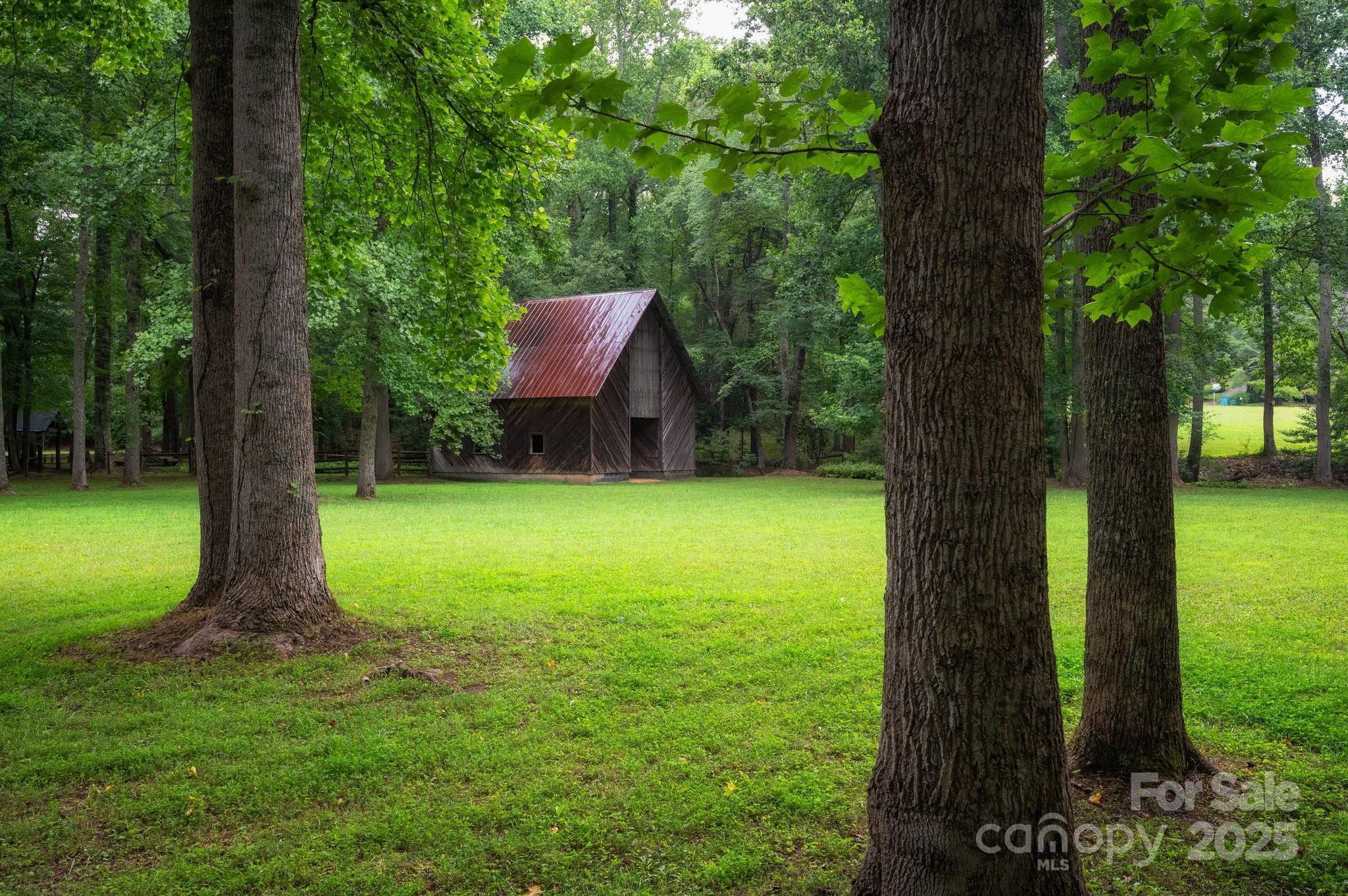 552 Averys Crk Road Arden, NC 28704 - Photo 35 of 48 a view of a garden with a tree