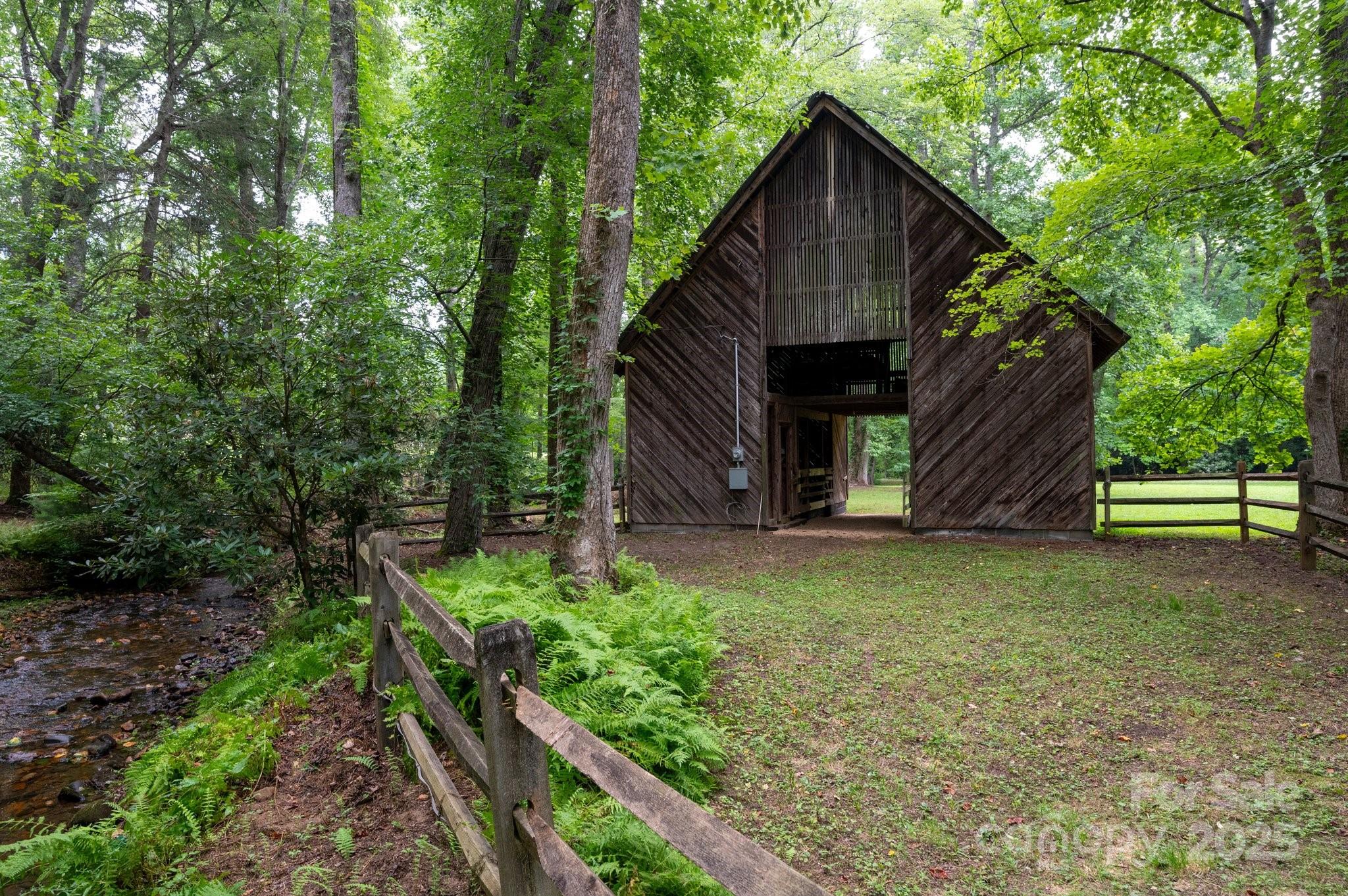 552 Averys Crk Road Arden, NC 28704 - Photo 36 of 48 a backyard of a house with lots of green space