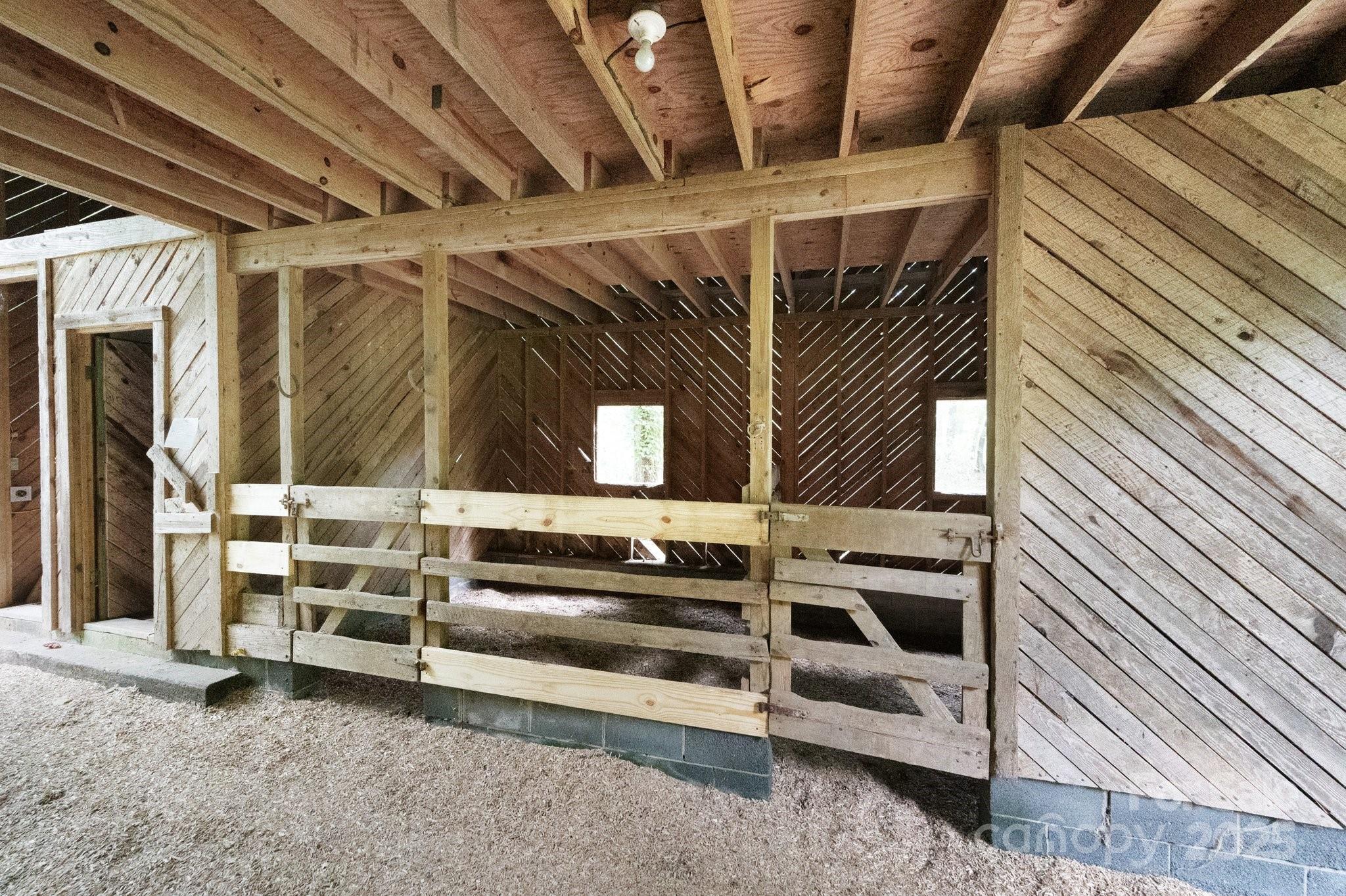 552 Averys Crk Road Arden, NC 28704 - Photo 38 of 48 a view of an empty room with wooden walls