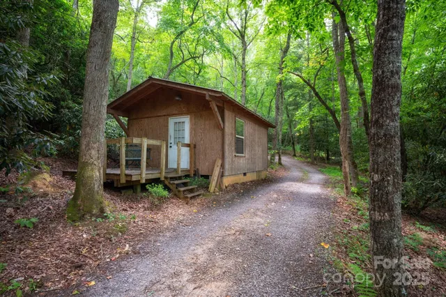 a living room with furniture a rug and a chandelier