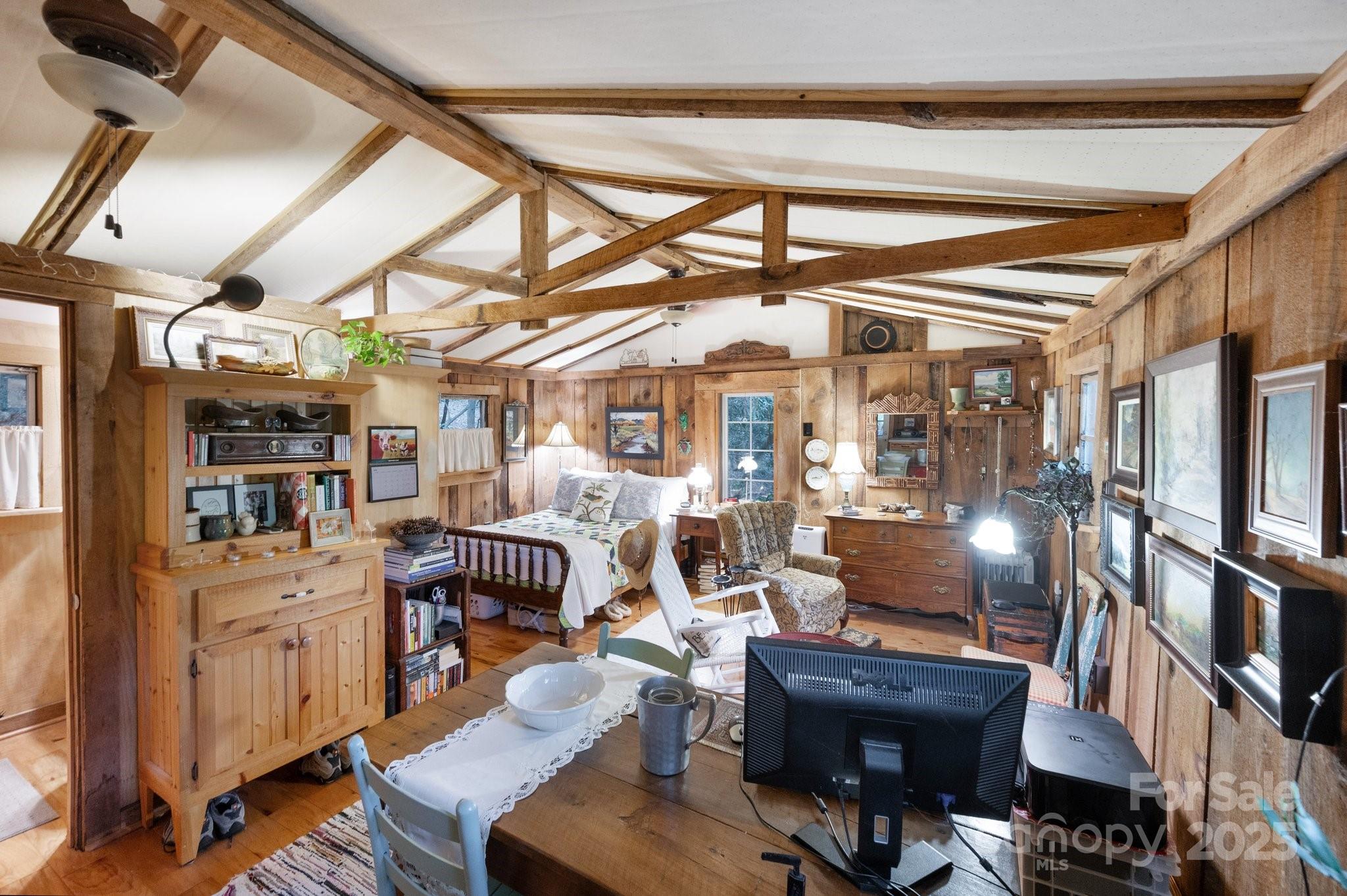 552 Averys Crk Road Arden, NC 28704 - Photo 41 of 48 a living room with furniture a rug and a chandelier