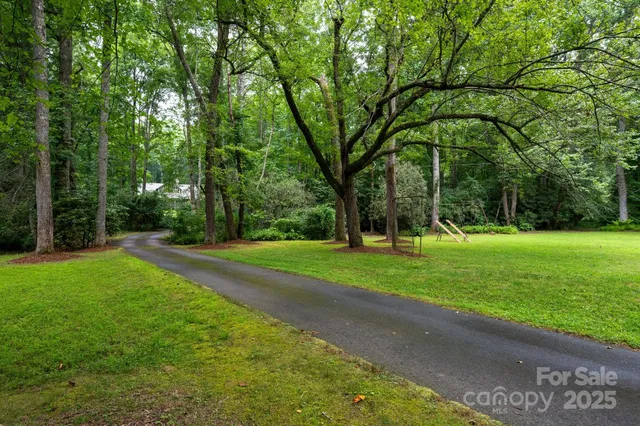 a view of a house with a yard porch and sitting area