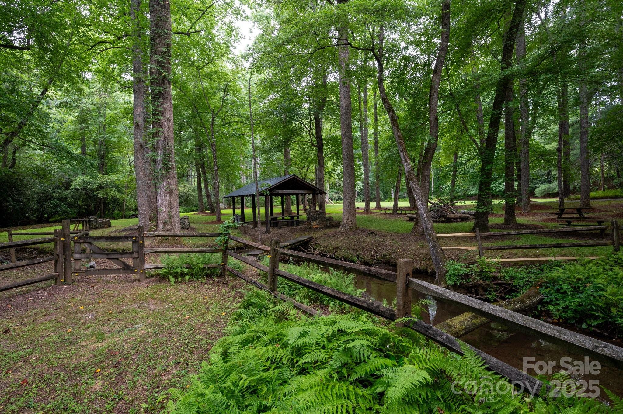 552 Averys Crk Road Arden, NC 28704 - Photo 8 of 48 a view of a bench in the garden