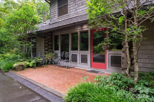 a view of a porch with a table chairs and a porch