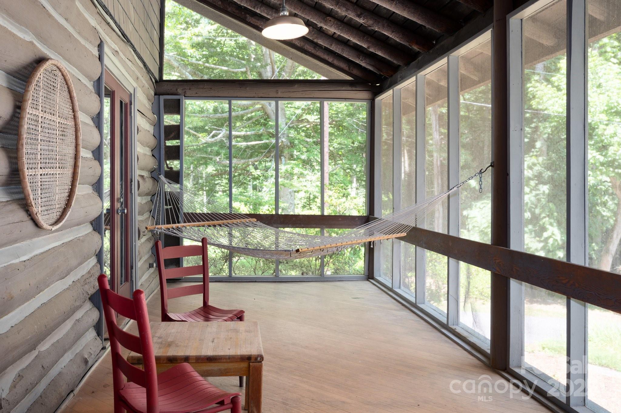 552 Averys Crk Road Arden, NC 28704 - Photo 10 of 48 a view of a porch with a table chairs and a porch