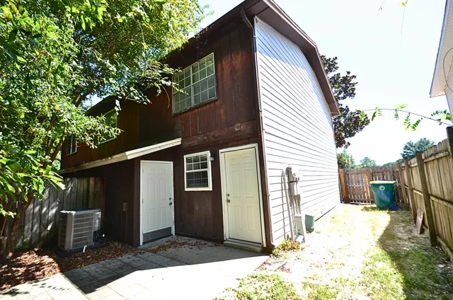 a backyard of a house with seating space