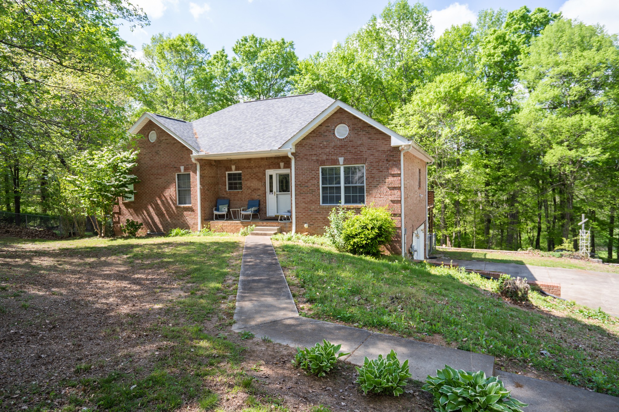 3077 Old Clarksville Sprgfld Road Adams, TN 37010 - Photo 2 of 33 a front view of a house with yard