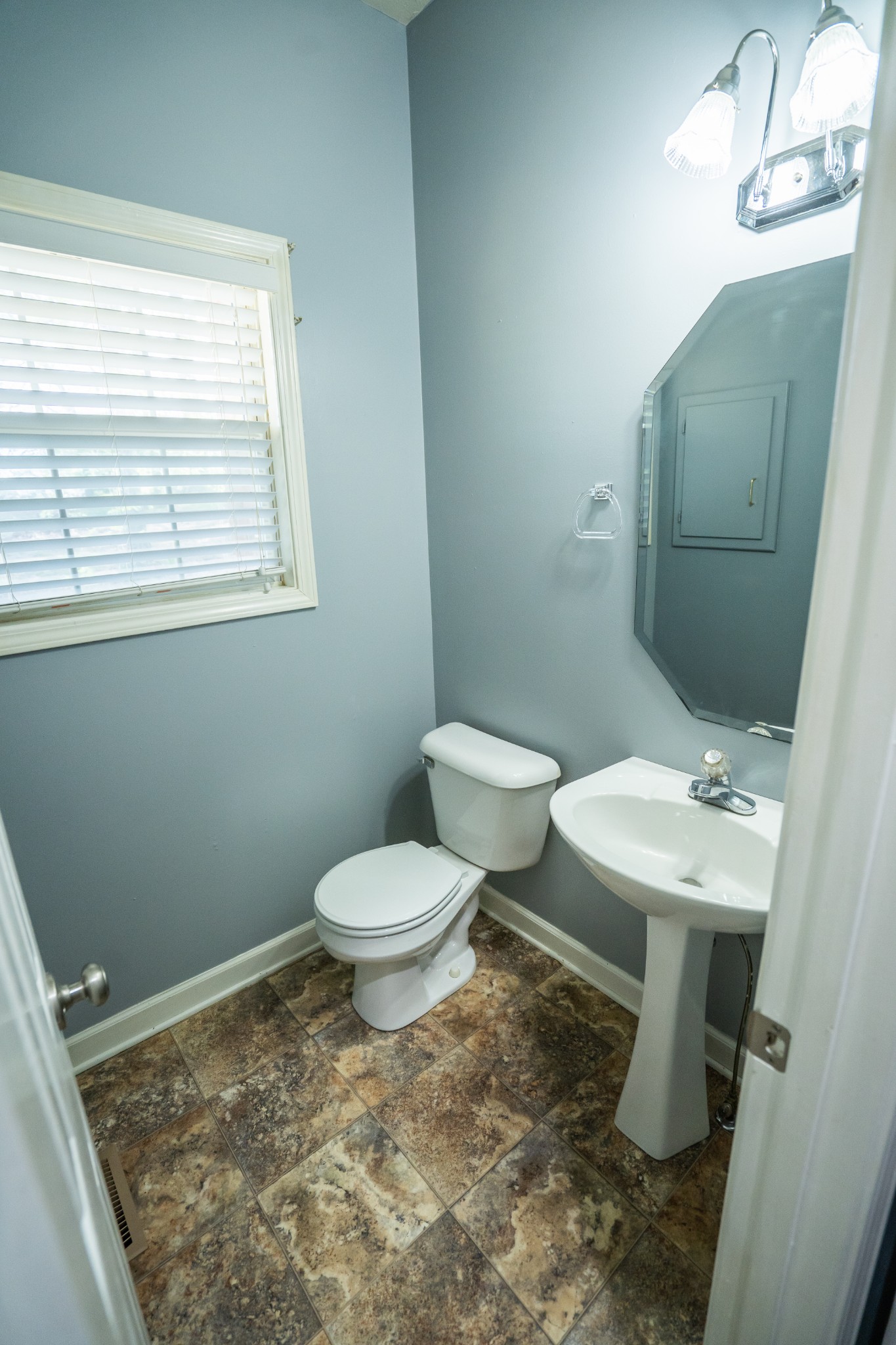 3077 Old Clarksville Sprgfld Road Adams, TN 37010 - Photo 11 of 33 a bathroom with a toilet sink and mirror