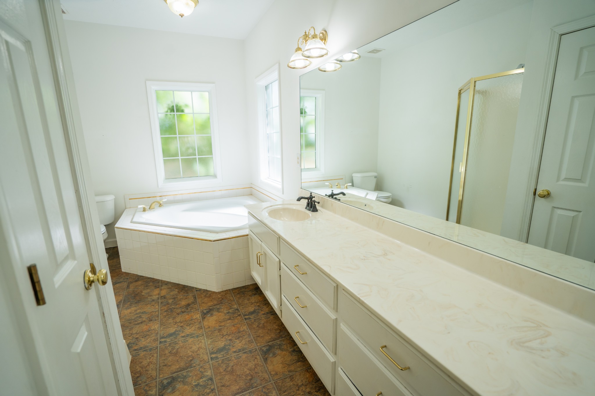 3077 Old Clarksville Sprgfld Road Adams, TN 37010 - Photo 17 of 33 a bathroom with a double vanity sink mirror and a bathtub