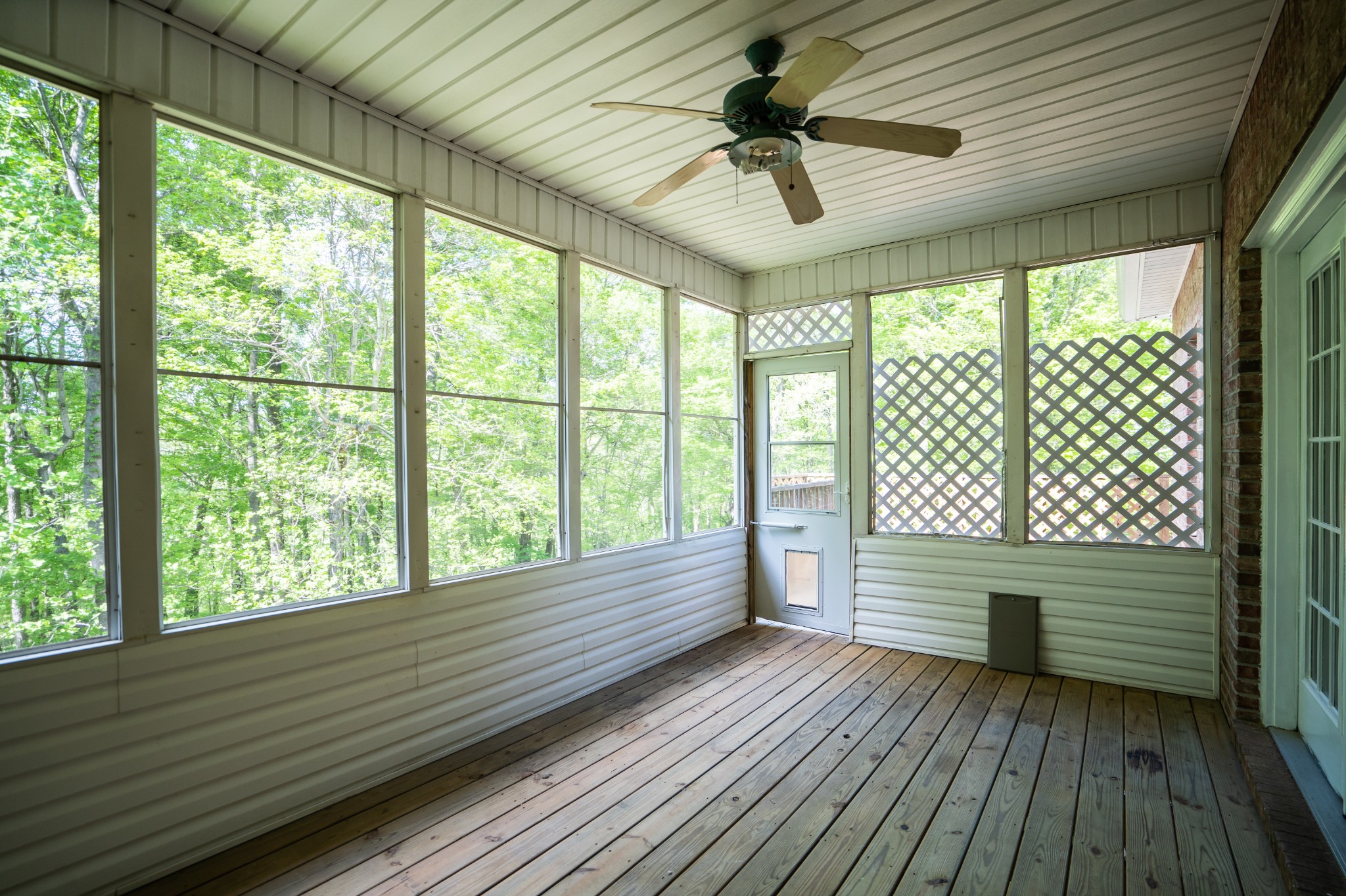 3077 Old Clarksville Sprgfld Road Adams, TN 37010 - Photo 19 of 33 a view of wooden balcony with a ceiling fan