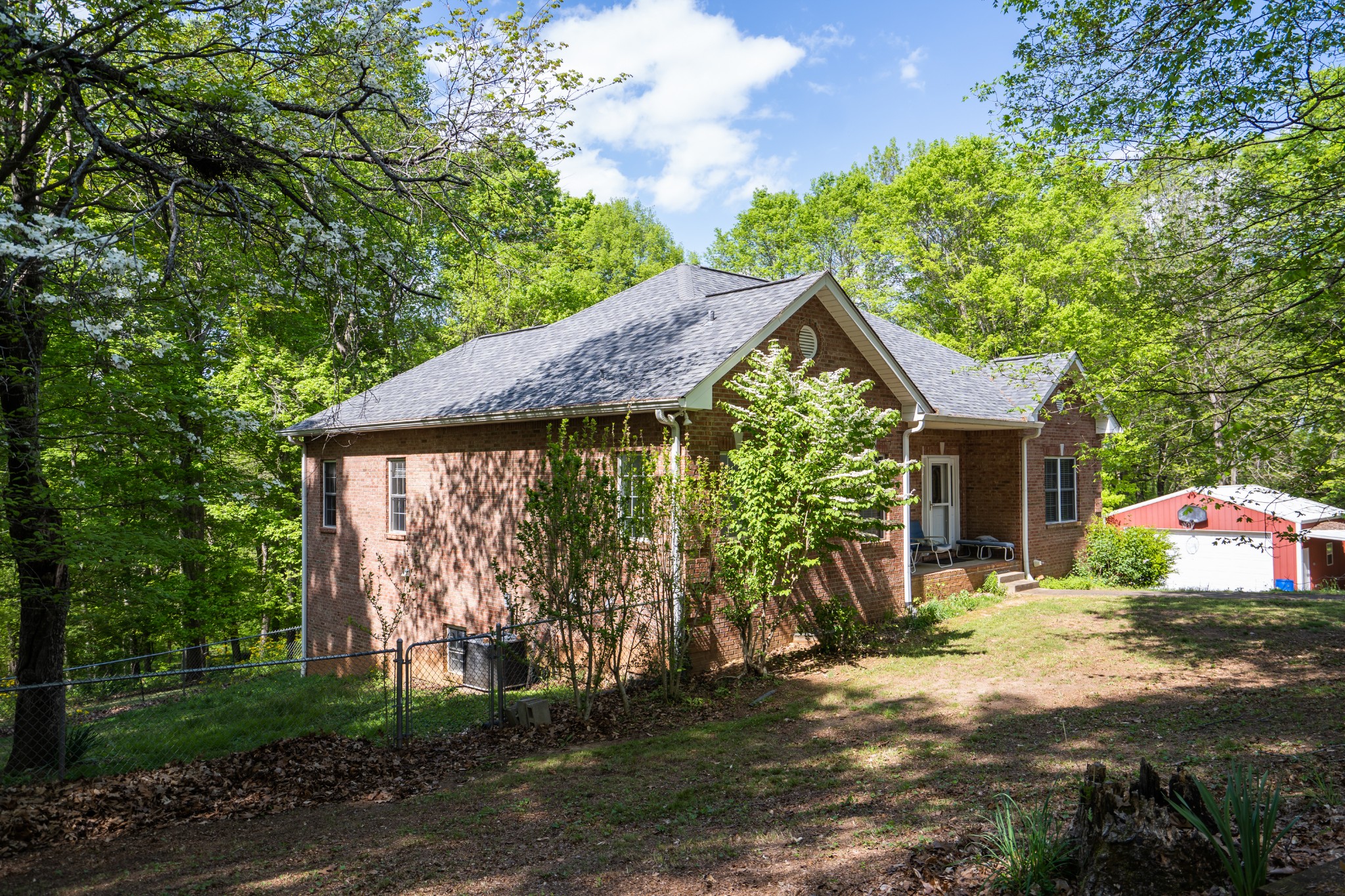 3077 Old Clarksville Sprgfld Road Adams, TN 37010 - Photo 3 of 33 a view of a house with backyard and garden