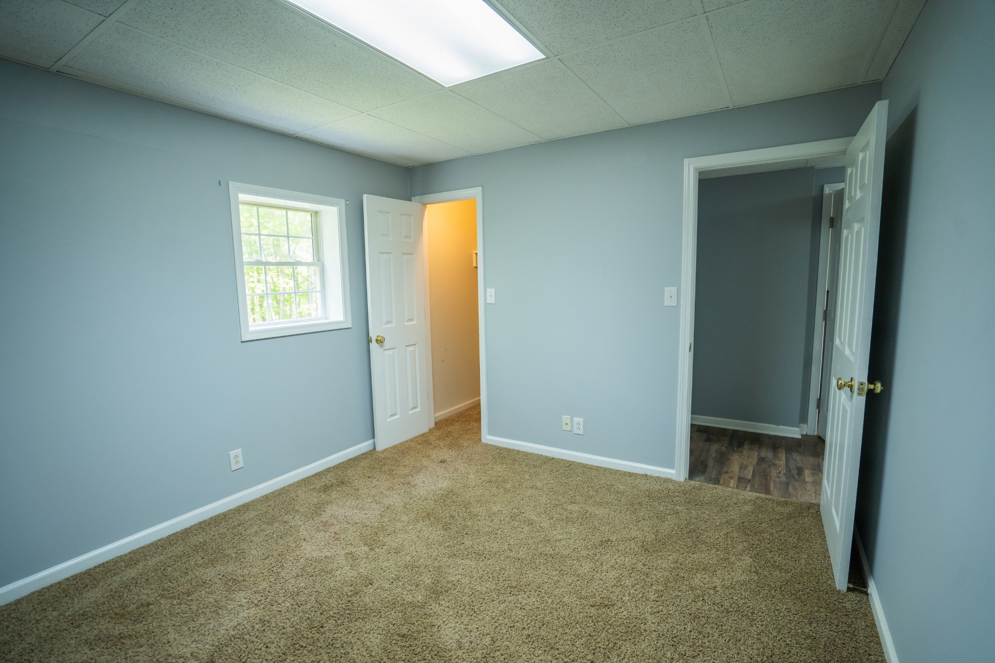 3077 Old Clarksville Sprgfld Road Adams, TN 37010 - Photo 25 of 33 an empty room with windows