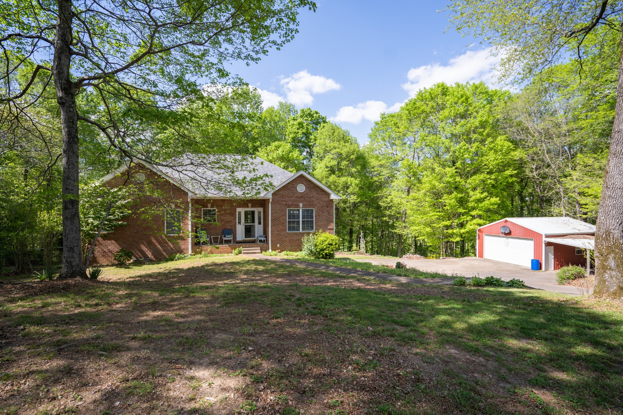 3077 Old Clarksville Sprgfld Road Adams, TN 37010 - Photo 4 of 33 a front view of a house with a yard