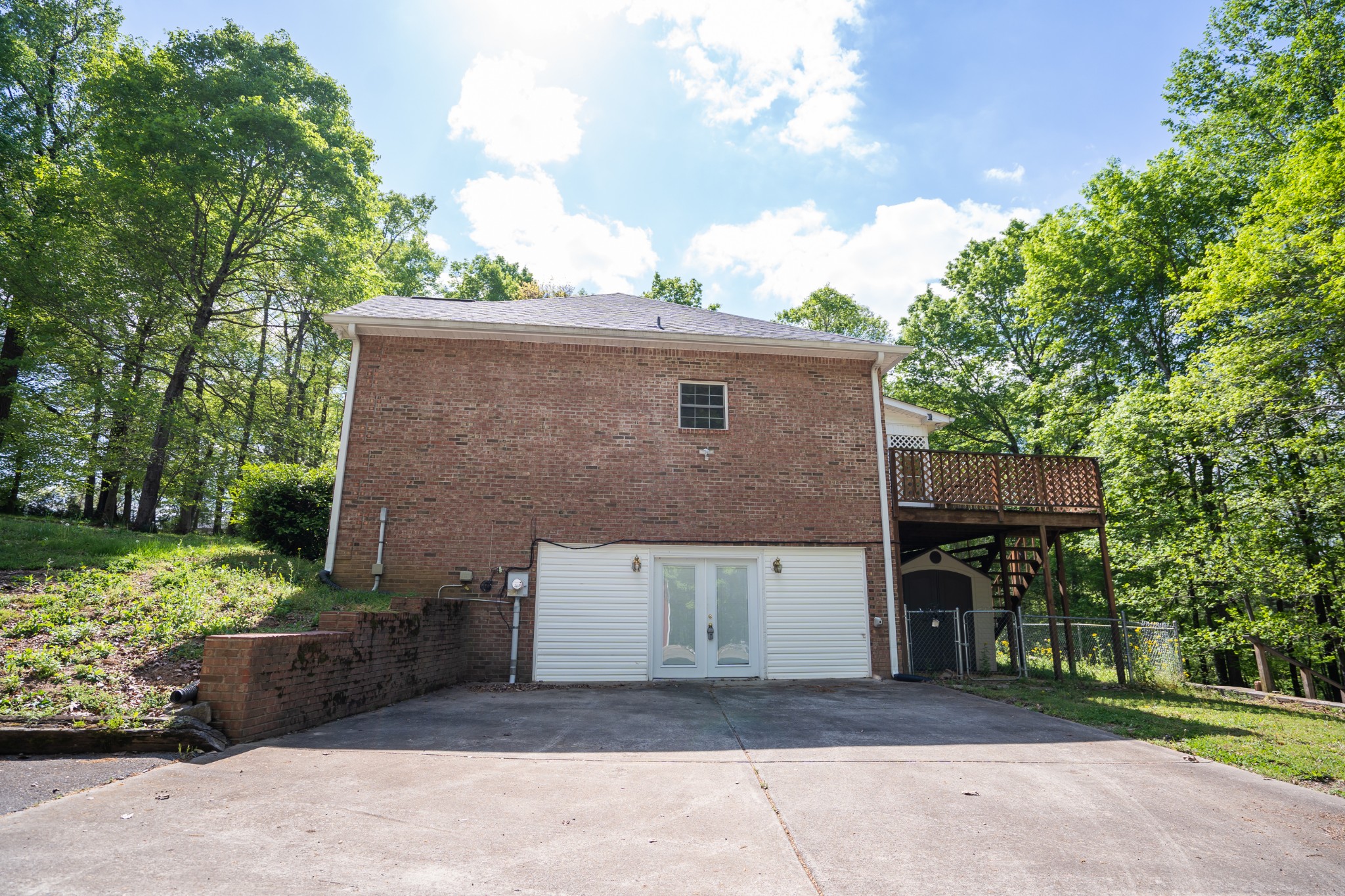 3077 Old Clarksville Sprgfld Road Adams, TN 37010 - Photo 5 of 33 a front view of a house with a garden