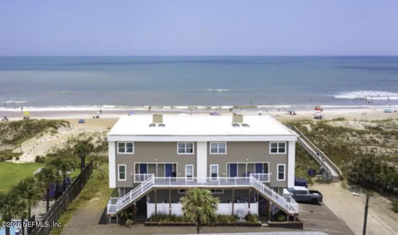 2 10th Street, Unit 2 St. Augustine Beach, FL 32080 - Photo 3 of 55 a front view of a house with balcony and car parked