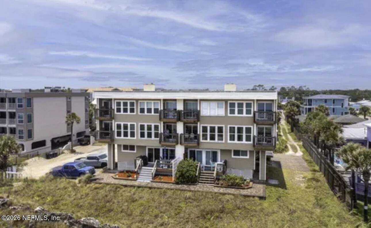 2 10th Street, Unit 2 St. Augustine Beach, FL 32080 - Photo 51 of 55 an aerial view of residential houses with yard and trees