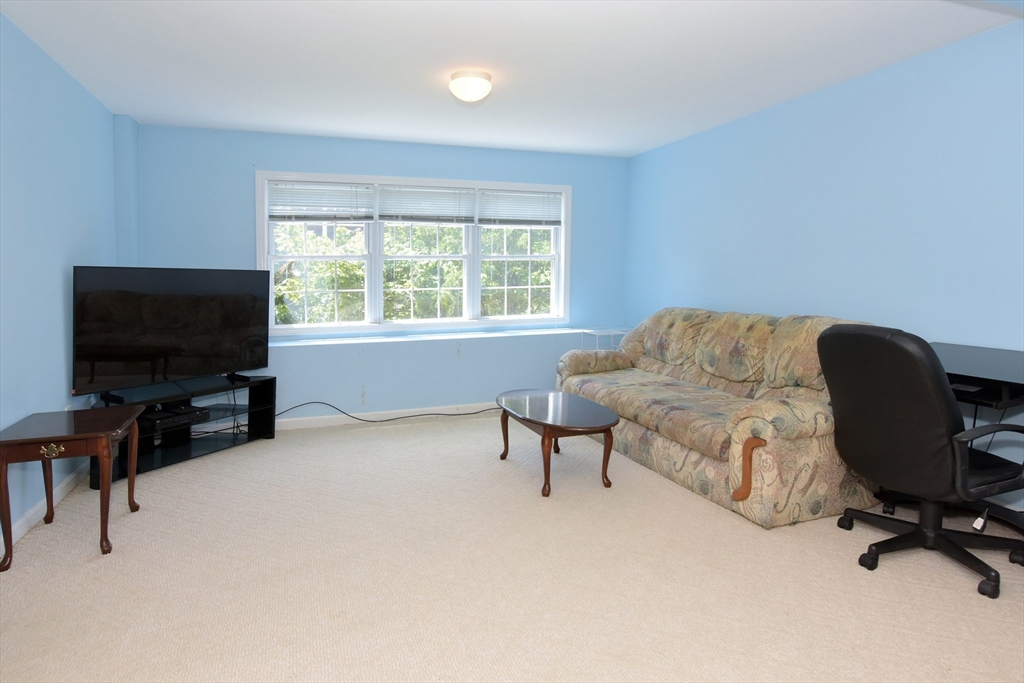 16 Sherwood Road Worcester, MA 01602 - Photo 21 of 30 a livingroom with workspace and a window