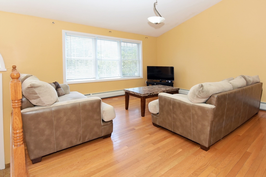 16 Sherwood Road Worcester, MA 01602 - Photo 10 of 30 a living room with furniture and a flat screen tv