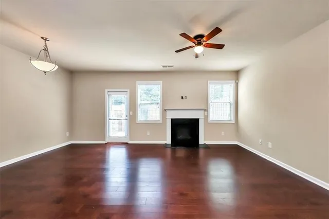 a view of kitchen with refrigerator and microwave