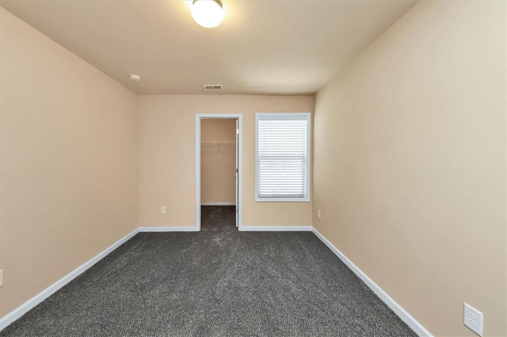 182 Townview Drive Woodstock, GA 30189 - Photo 15 of 37 a view of an empty room with a window