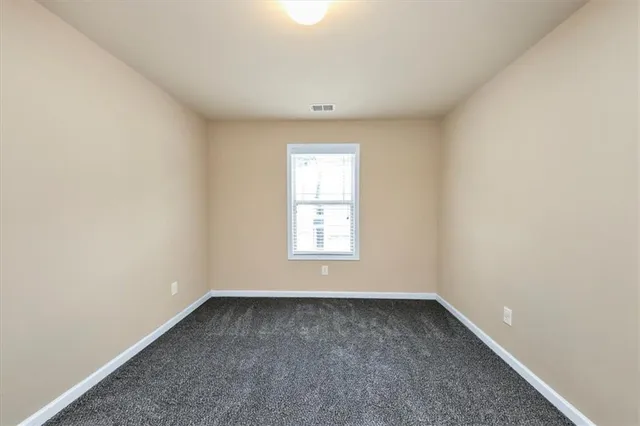 a bathroom with a toilet and a bathtub
