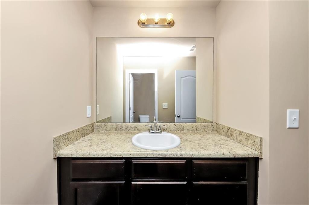 182 Townview Drive Woodstock, GA 30189 - Photo 19 of 37 a bathroom with a sink and a mirror