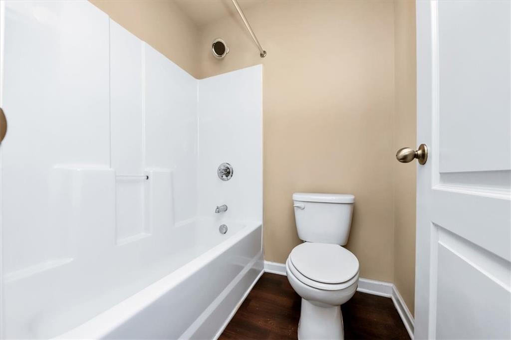 182 Townview Drive Woodstock, GA 30189 - Photo 20 of 37 a bathroom with a toilet and a bathtub