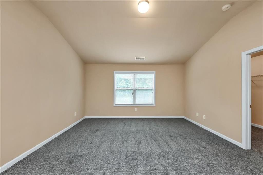 182 Townview Drive Woodstock, GA 30189 - Photo 22 of 37 an empty room with a window