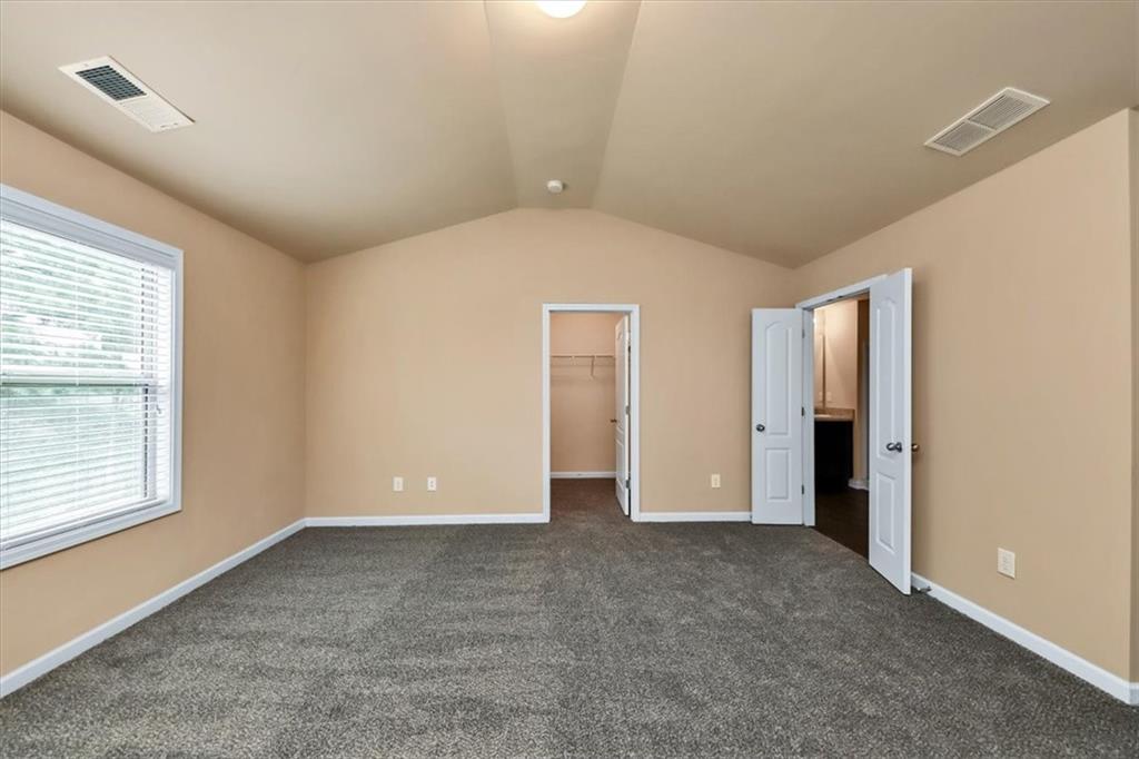 182 Townview Drive Woodstock, GA 30189 - Photo 23 of 37 a view of an empty room with closet and a window
