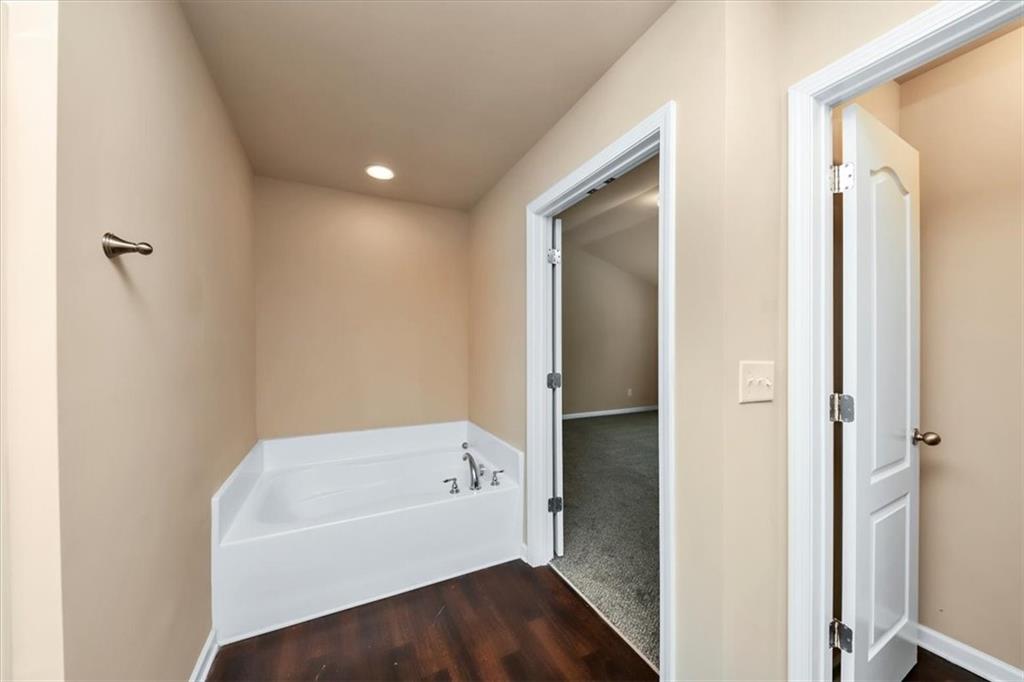 182 Townview Drive Woodstock, GA 30189 - Photo 29 of 37 a bathroom with a bathtub and a shower