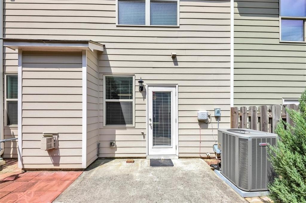 182 Townview Drive Woodstock, GA 30189 - Photo 31 of 37 a view of a house with a window and brick walls