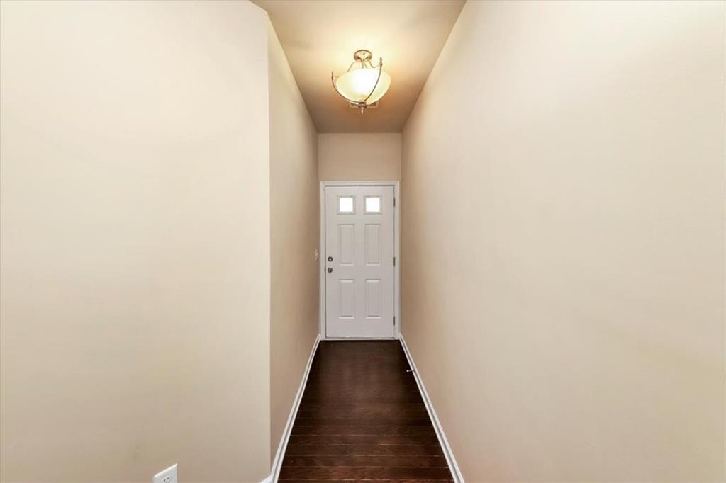 182 Townview Drive Woodstock, GA 30189 - Photo 4 of 37 a view of a hallway with wooden floor