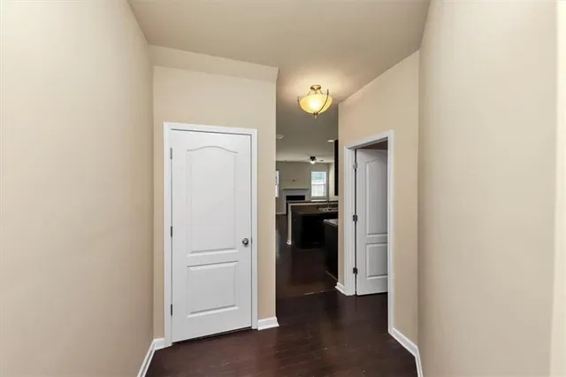 a white toilet sitting next to a bathroom sink