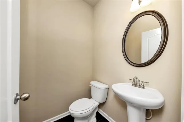 a kitchen with granite countertop stainless steel appliances window a sink and a counter space
