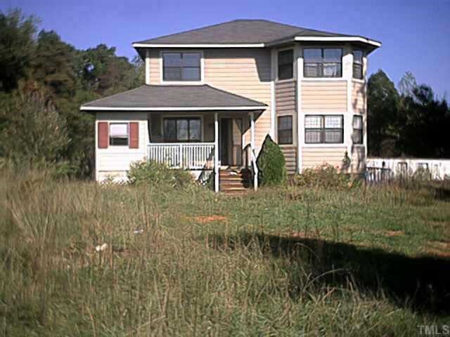 4257 Pixley Pritchard Road Timberlake, NC 27583 - Photo 1 of 1 a front view of a house with yard and green space
