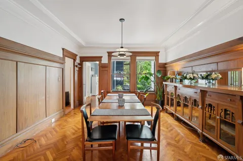 a view of a dining room with furniture window and wooden floor