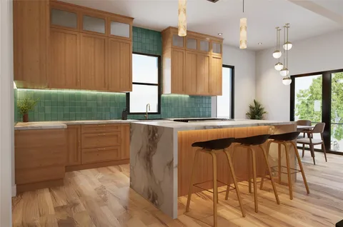 a kitchen with a sink cabinets and wooden floor