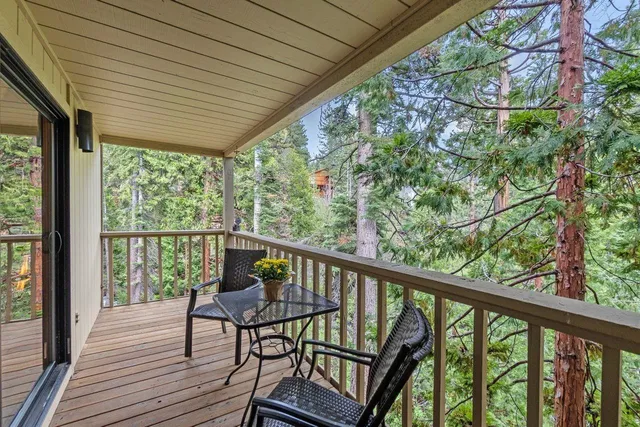 a view of a two chairs in the balcony