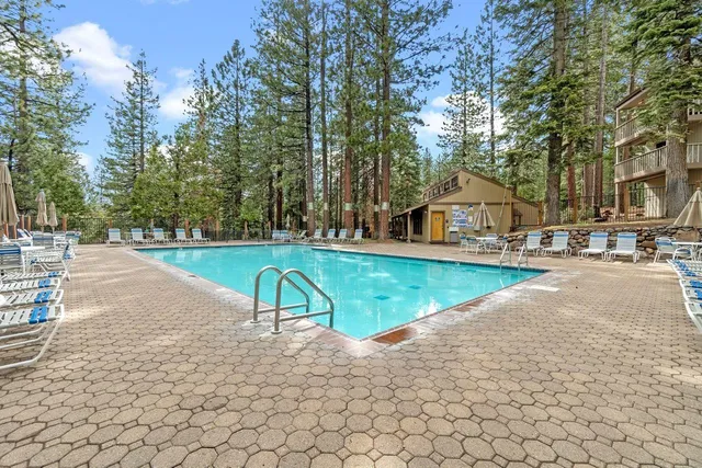 a view of a swimming pool with a lounge chair